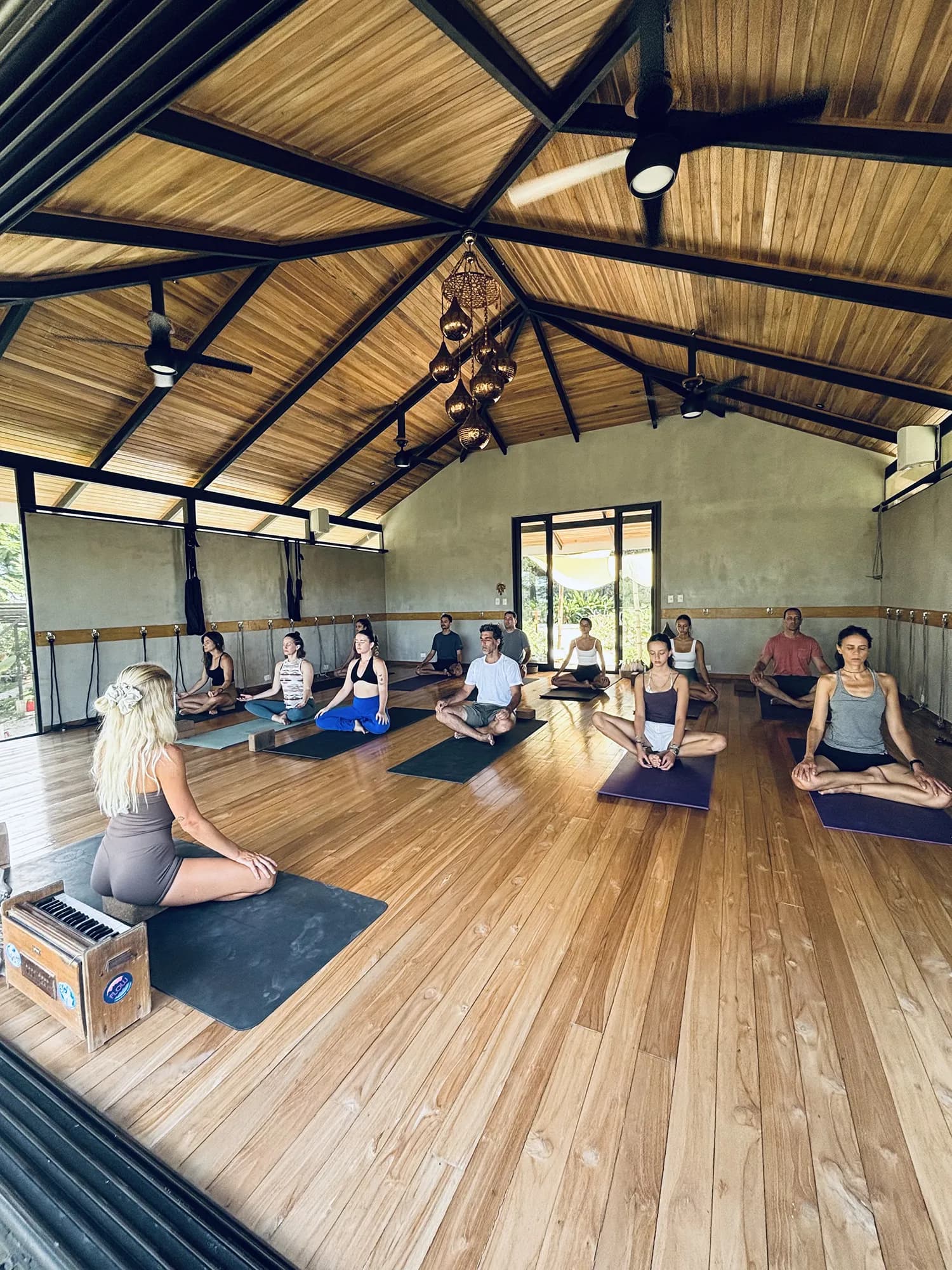 A wider moment of practice in the open-air shala